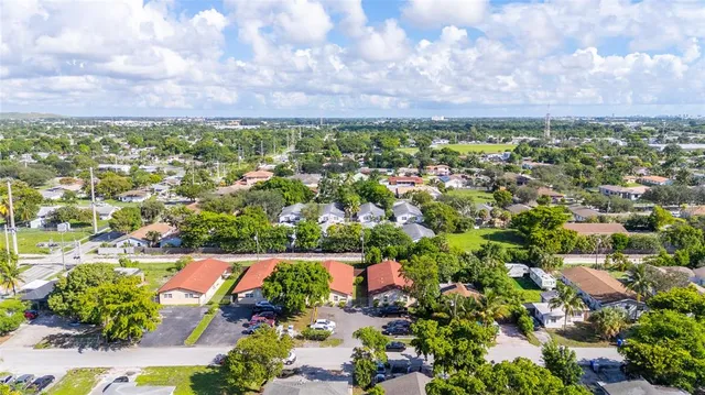 an aerial view of a houses with outdoor space