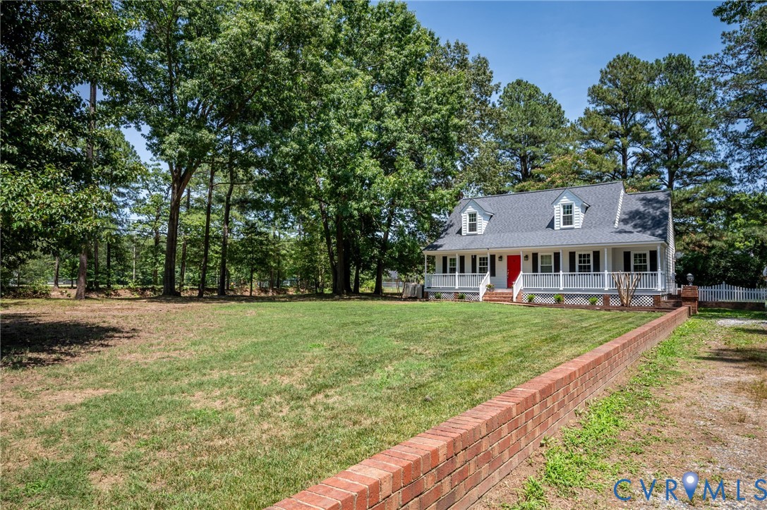 10110 Holly Road Mechanicsville, VA 23116 - Photo 2 of 26 White-sided residence featuring a classic front po