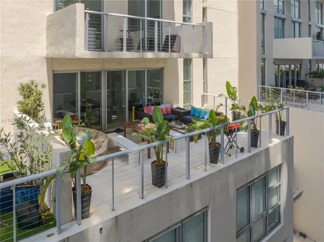 a front view of building with balcony