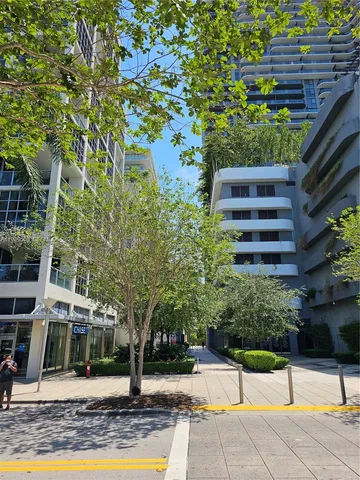 a view of a building with a yard