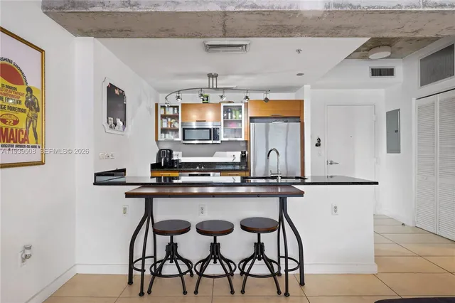 a kitchen with stainless steel appliances a sink and stove