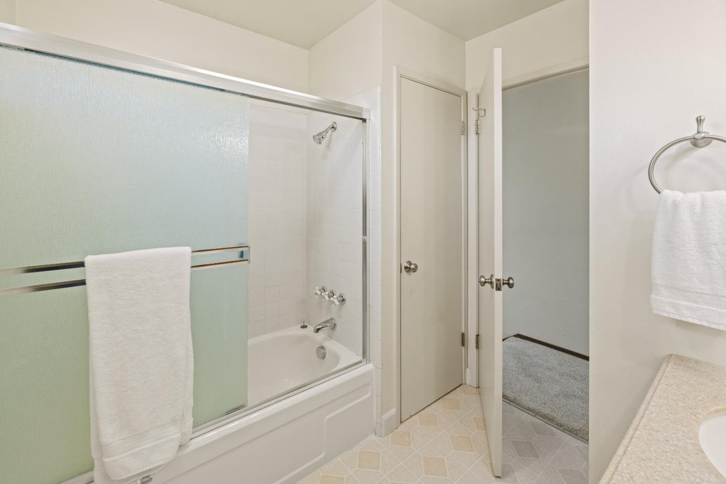 902 Maple Street Pacific Grove, CA 93950 - Photo 23 of 35 a bathroom with a bathtub and a shower
