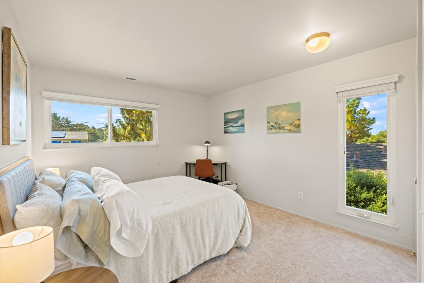 902 Maple Street Pacific Grove, CA 93950 - Photo 24 of 35 a bedroom with a bed and a window