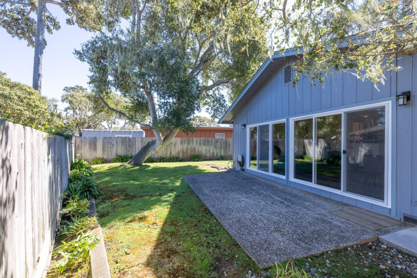 902 Maple Street Pacific Grove, CA 93950 - Photo 28 of 35 a view of a house with backyard and a garden
