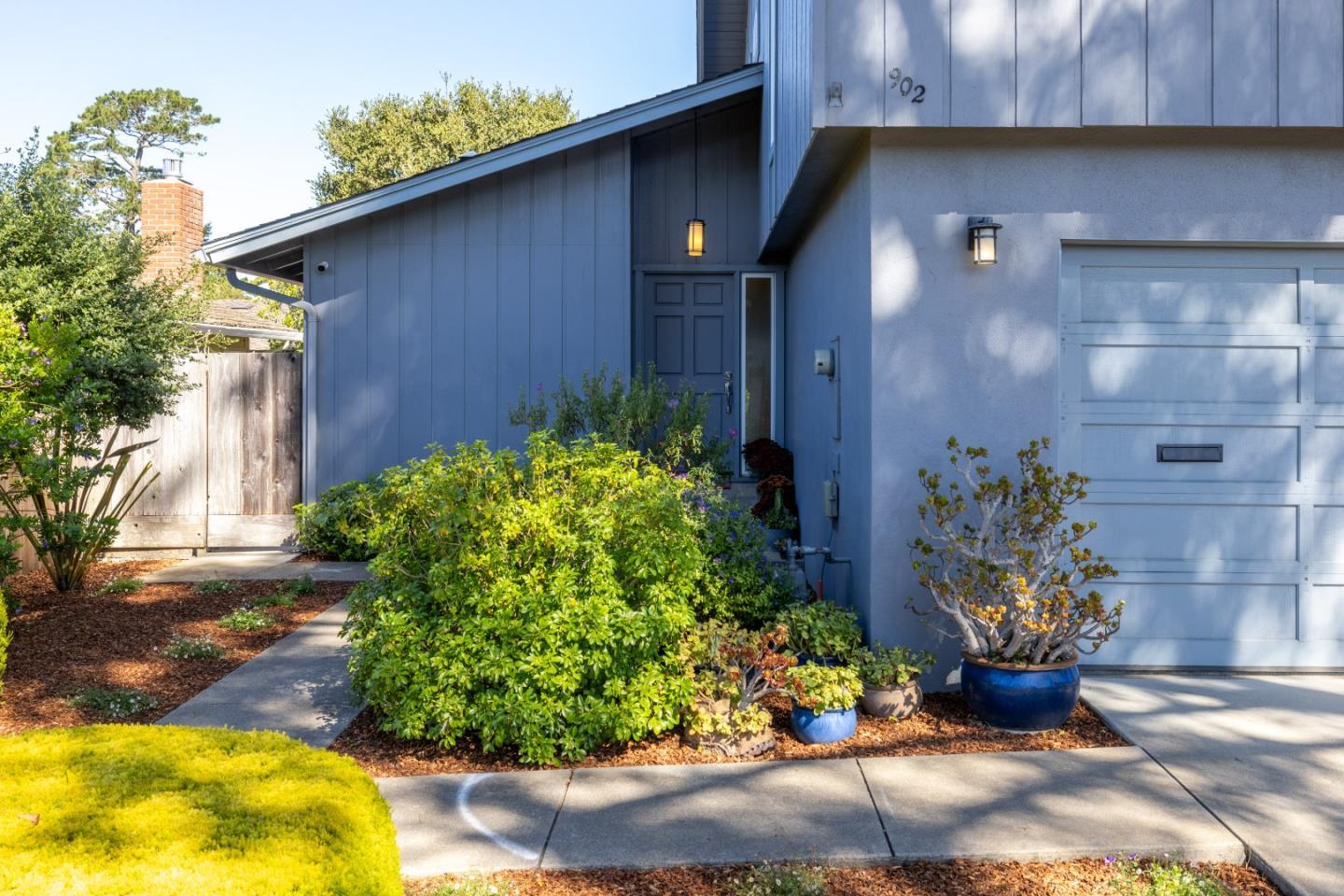 902 Maple Street Pacific Grove, CA 93950 - Photo 31 of 35 a front view of a house with a yard