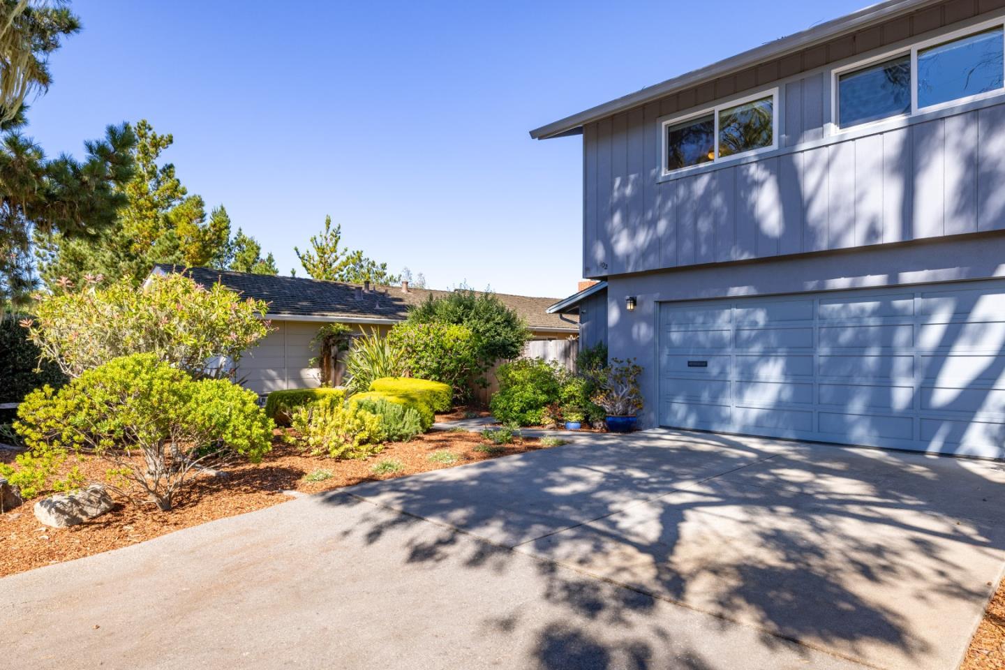 902 Maple Street Pacific Grove, CA 93950 - Photo 32 of 35 a front view of a house with a yard