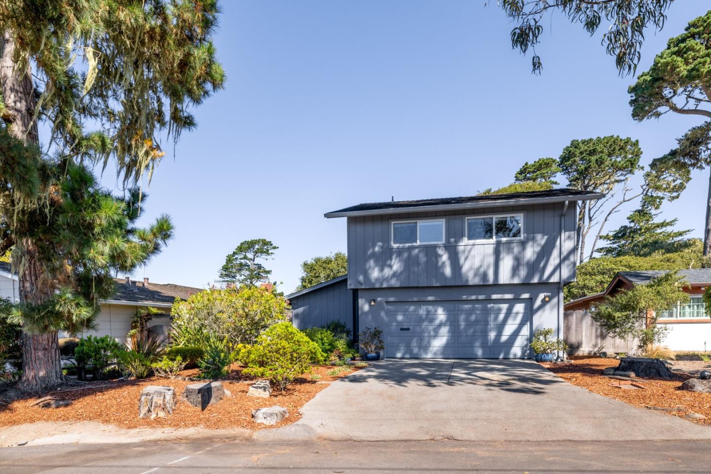 902 Maple Street Pacific Grove, CA 93950 - Photo 34 of 35 a front view of a house with garden