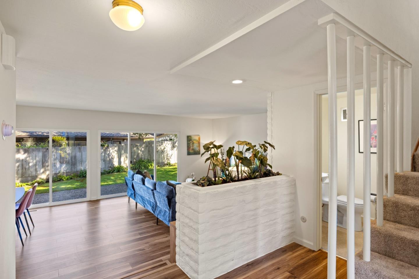902 Maple Street Pacific Grove, CA 93950 - Photo 5 of 35 a living room with furniture and a large window
