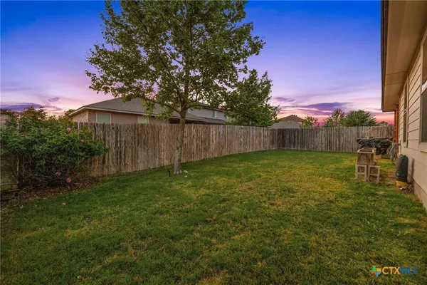 a view of a backyard with a garden