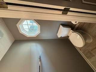 6213 Hickory Ln Circle Union City, GA 30291 - Photo 6 of 15 a white toilet sitting next to a window in a bathroom