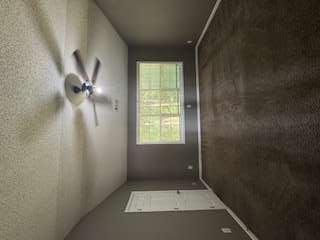 6213 Hickory Ln Circle Union City, GA 30291 - Photo 9 of 15 an empty room with windows and ceiling fan