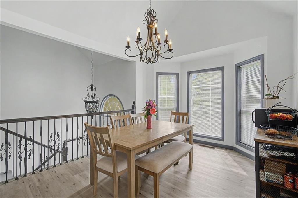 409 Windsor Way Canton, GA 30115 - Photo 12 of 51 a view of a dining room with furniture window and wooden floor