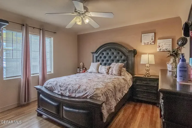 a bedroom with a bed and a dresser