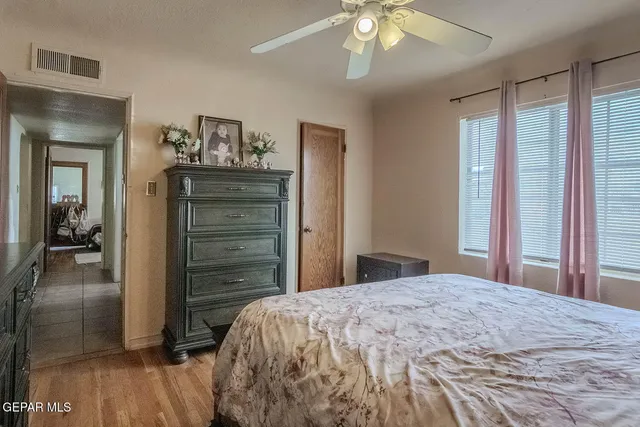a bedroom with a bed and a dresser