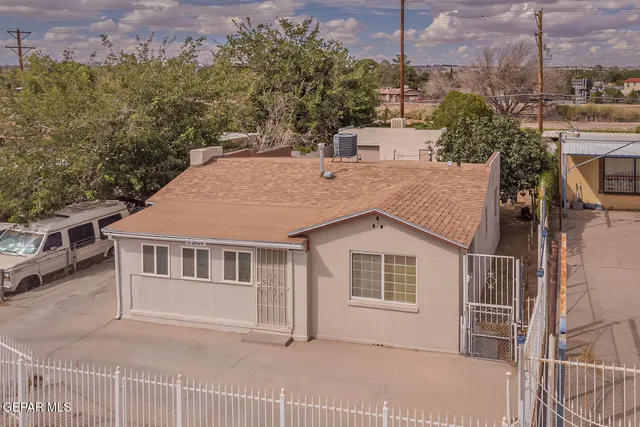 a aerial view of a house with a yard