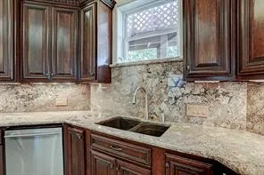 a kitchen with granite countertop a sink and a granite counter tops