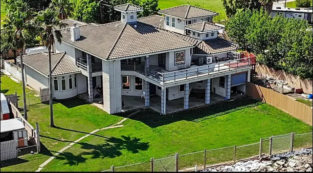 a aerial view of a house with a yard