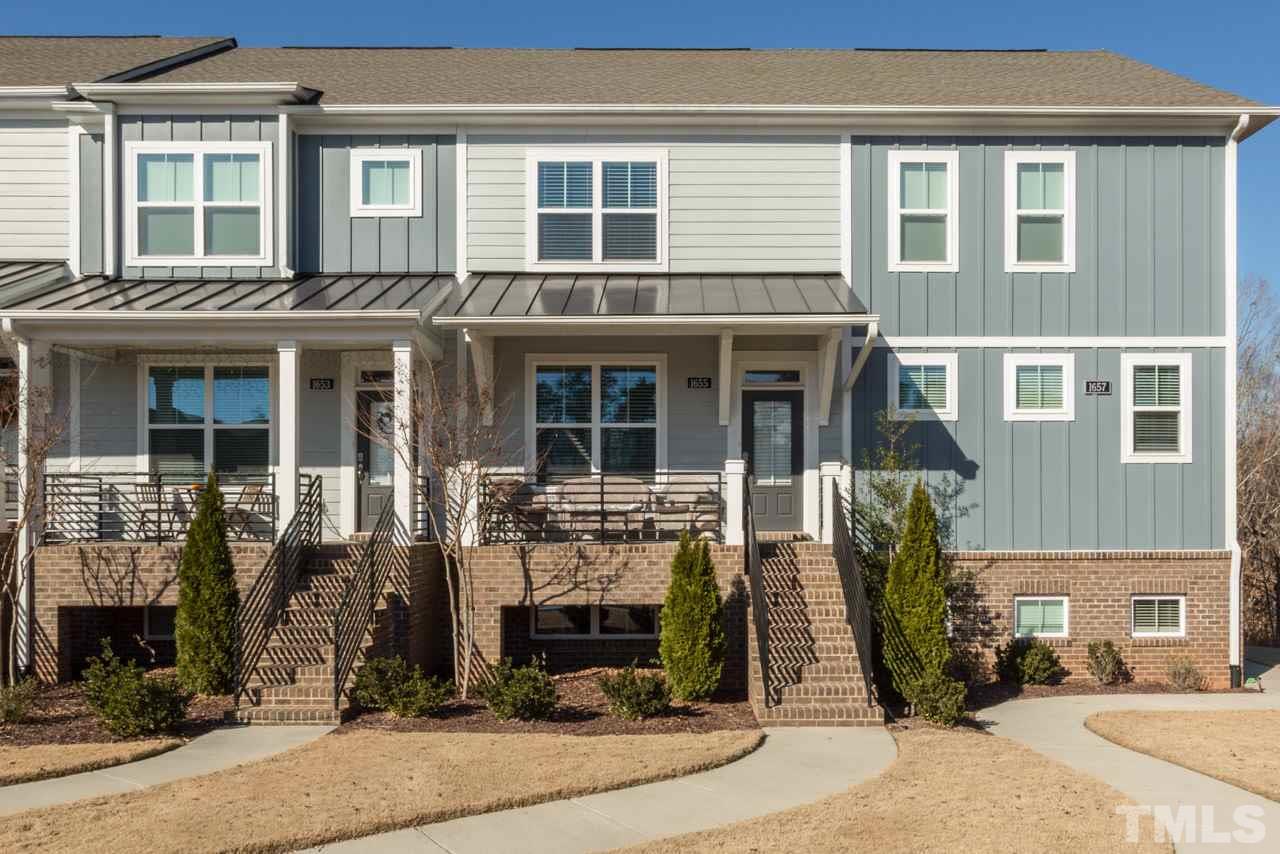 1655 Crafton Way Raleigh, NC 27607 - Photo 2 of 25 front view of a brick house with a small yard
