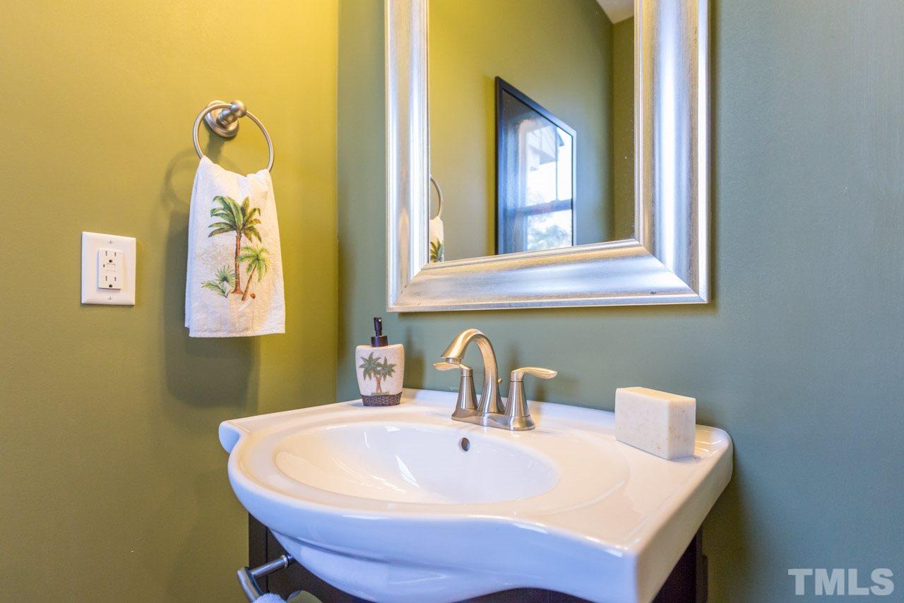 1655 Crafton Way Raleigh, NC 27607 - Photo 12 of 25 a bathroom with a sink and a mirror