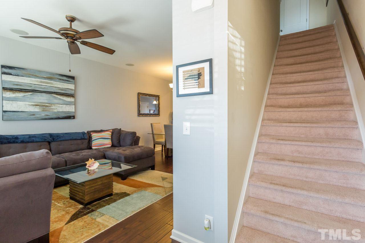 1655 Crafton Way Raleigh, NC 27607 - Photo 14 of 25 a living room with furniture and a ceiling fan
