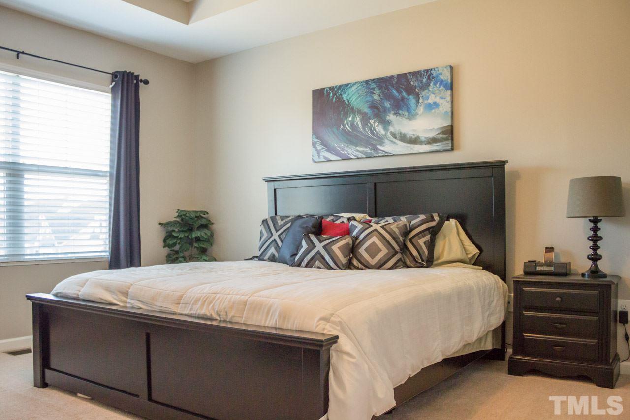 1655 Crafton Way Raleigh, NC 27607 - Photo 15 of 25 a bedroom with a bed and window