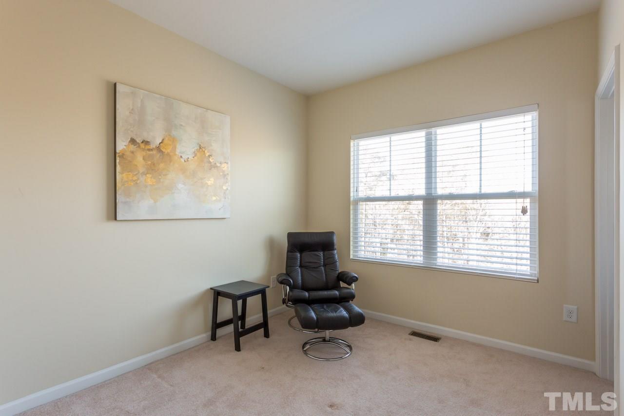 1655 Crafton Way Raleigh, NC 27607 - Photo 18 of 25 a living room with furniture and a window