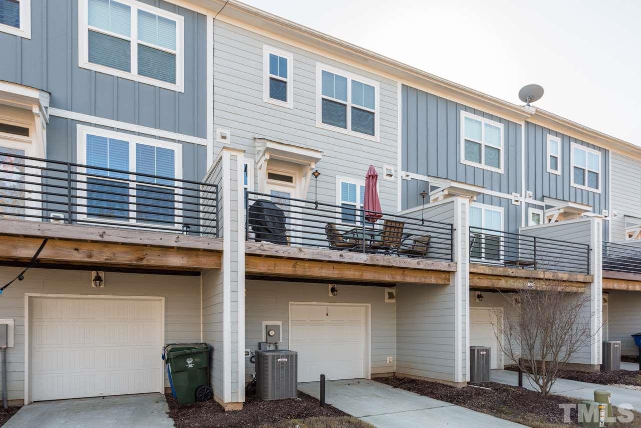 1655 Crafton Way Raleigh, NC 27607 - Photo 23 of 25 a front view of a building with many windows