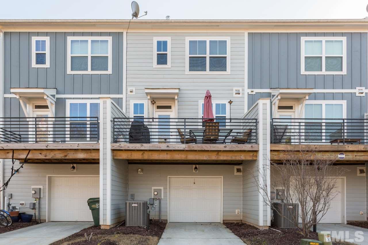 1655 Crafton Way Raleigh, NC 27607 - Photo 24 of 25 a front view of a house with large windows