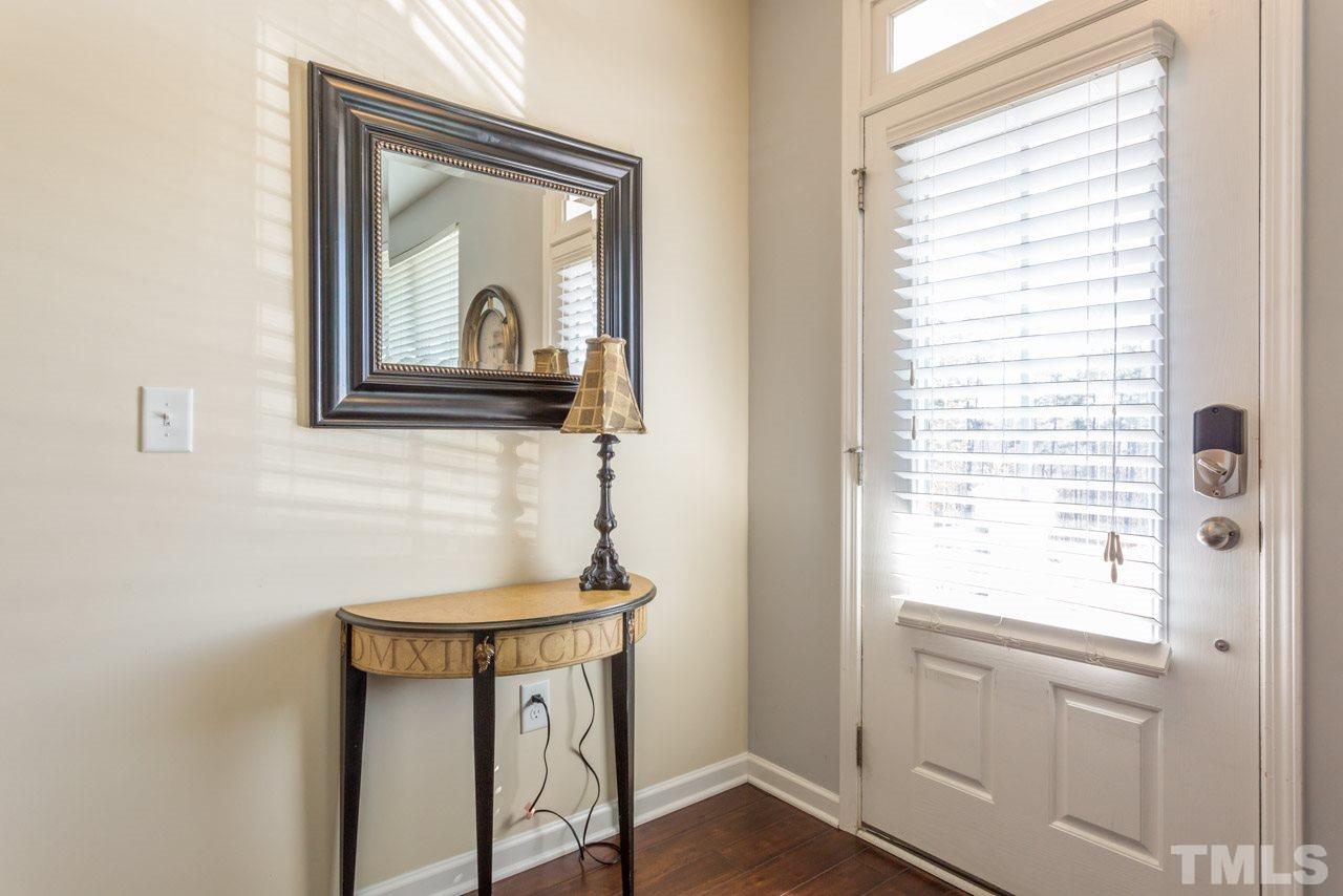 1655 Crafton Way Raleigh, NC 27607 - Photo 4 of 25 a bathroom with a sink a mirror and a window