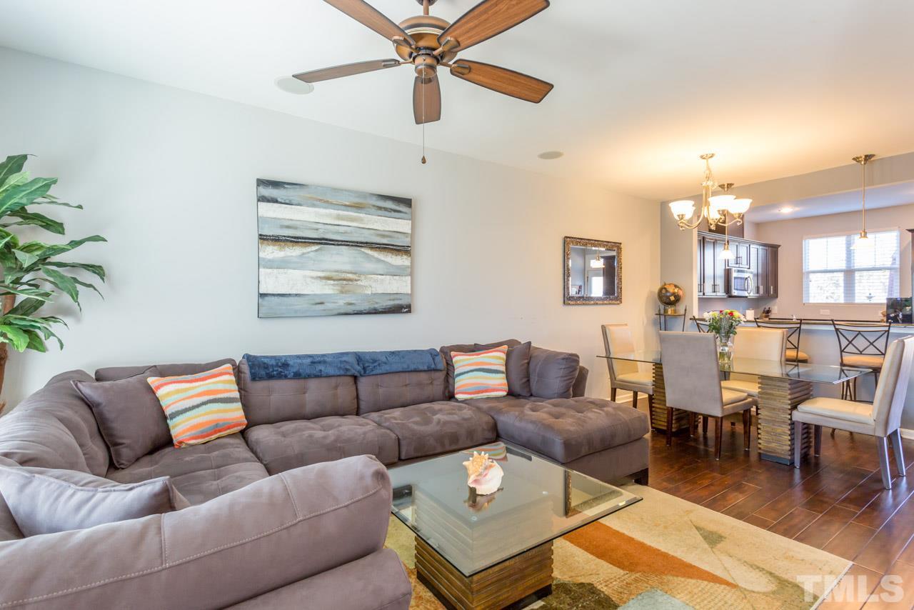 1655 Crafton Way Raleigh, NC 27607 - Photo 5 of 25 a living room with furniture and a large window