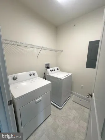 a kitchen with kitchen island a sink stove and refrigerator