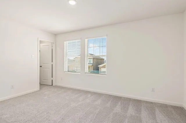 a bathroom with a sink shower and a mirror