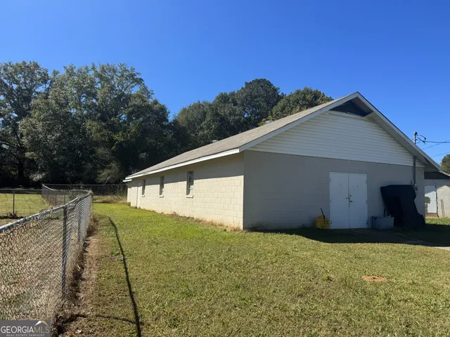 a house view with a backyard space