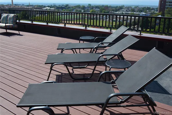 a view of a balcony with furniture