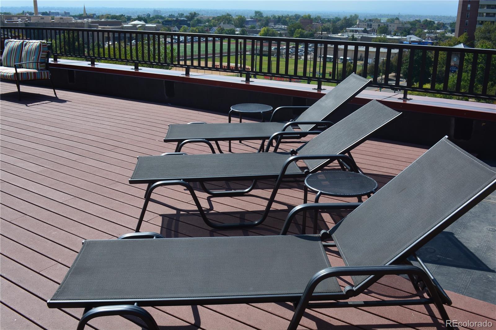 1120 Delaware Street, Unit 201 Denver, CO 80204 - Photo 21 of 25 a view of a balcony with furniture