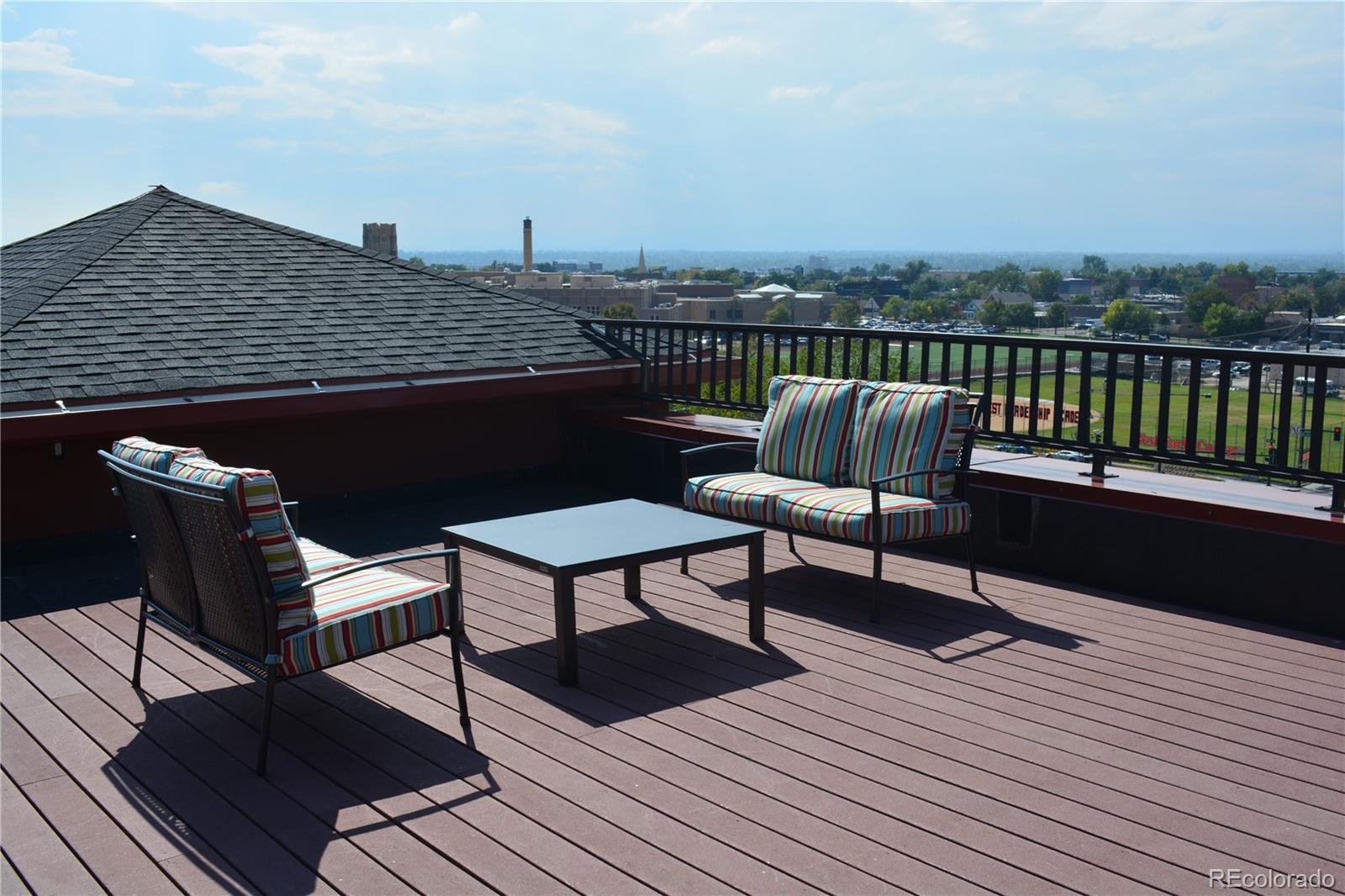 1120 Delaware Street, Unit 201 Denver, CO 80204 - Photo 24 of 25 a roof deck with a couple of chairs
