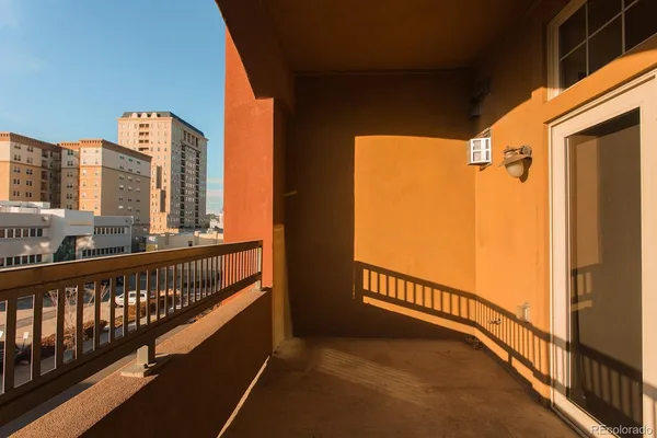 a view of balcony with furniture