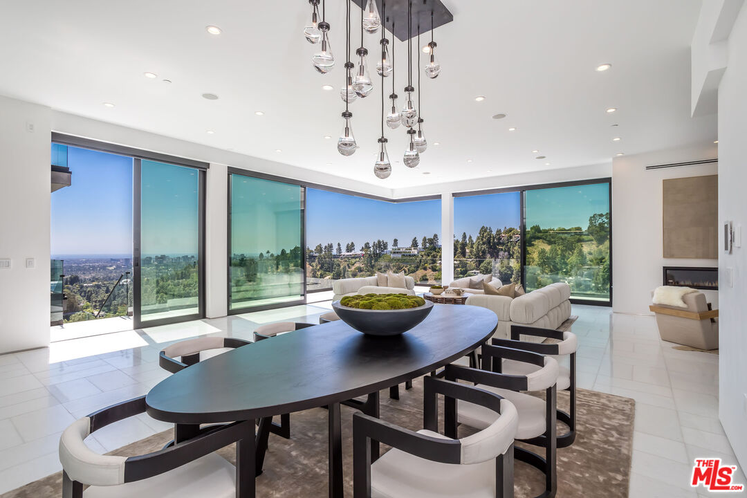 9406 Lloydcrest Drive Beverly Hills, CA 90210 - Photo 13 of 52 a view of a dining room with furniture window and outside view