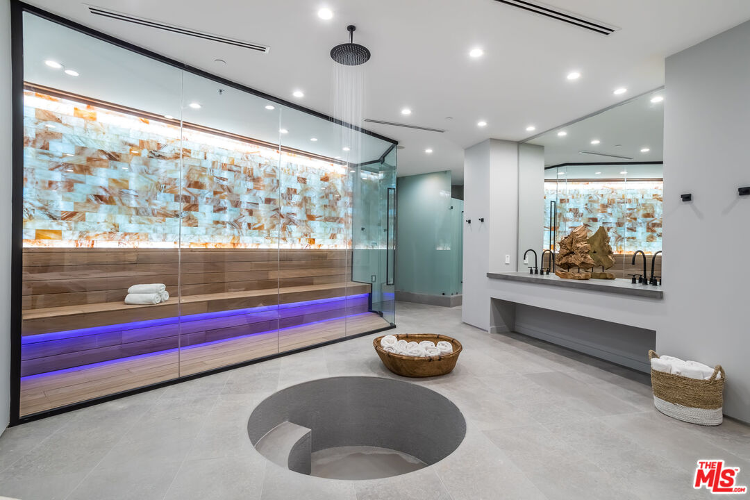 9406 Lloydcrest Drive Beverly Hills, CA 90210 - Photo 21 of 52 a kitchen with stainless steel appliances granite countertop a sink and a large window