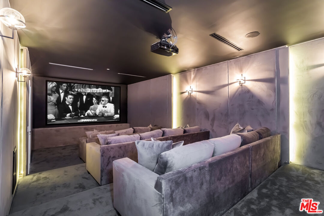 9406 Lloydcrest Drive Beverly Hills, CA 90210 - Photo 22 of 52 a living room with furniture and a fireplace