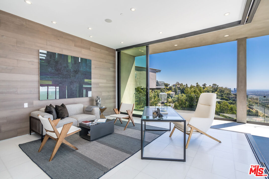 9406 Lloydcrest Drive Beverly Hills, CA 90210 - Photo 23 of 52 a building outdoor space with patio furniture and potted plants