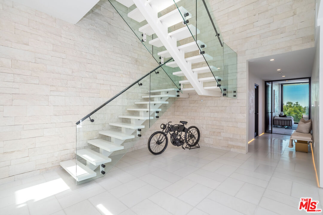 9406 Lloydcrest Drive Beverly Hills, CA 90210 - Photo 25 of 52 a view of entryway with livingroom and stairs