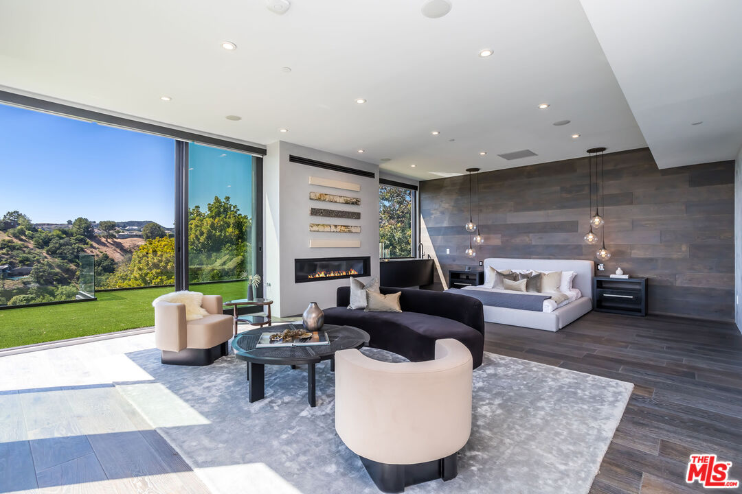 9406 Lloydcrest Drive Beverly Hills, CA 90210 - Photo 27 of 52 a living room with furniture and a garden