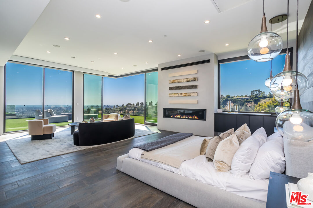 9406 Lloydcrest Drive Beverly Hills, CA 90210 - Photo 28 of 52 a living room with furniture and a large window