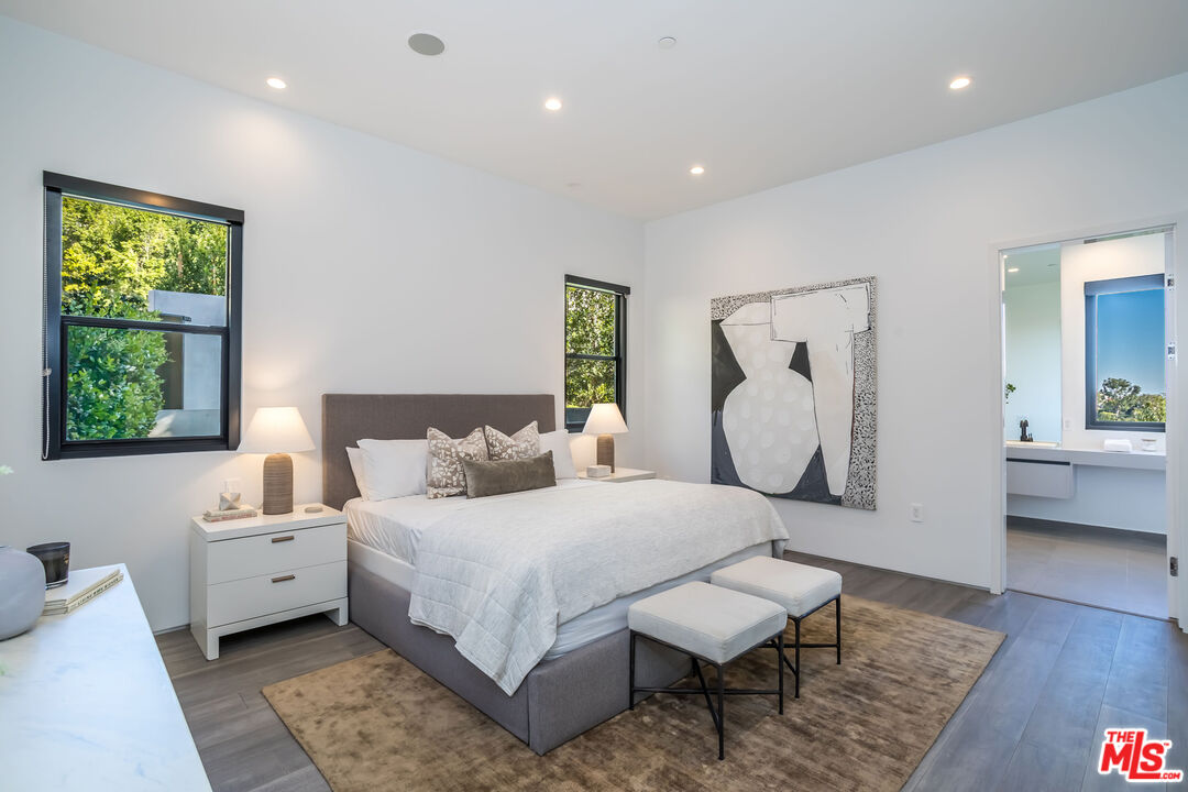 9406 Lloydcrest Drive Beverly Hills, CA 90210 - Photo 43 of 52 a bedroom with a bed and a couch