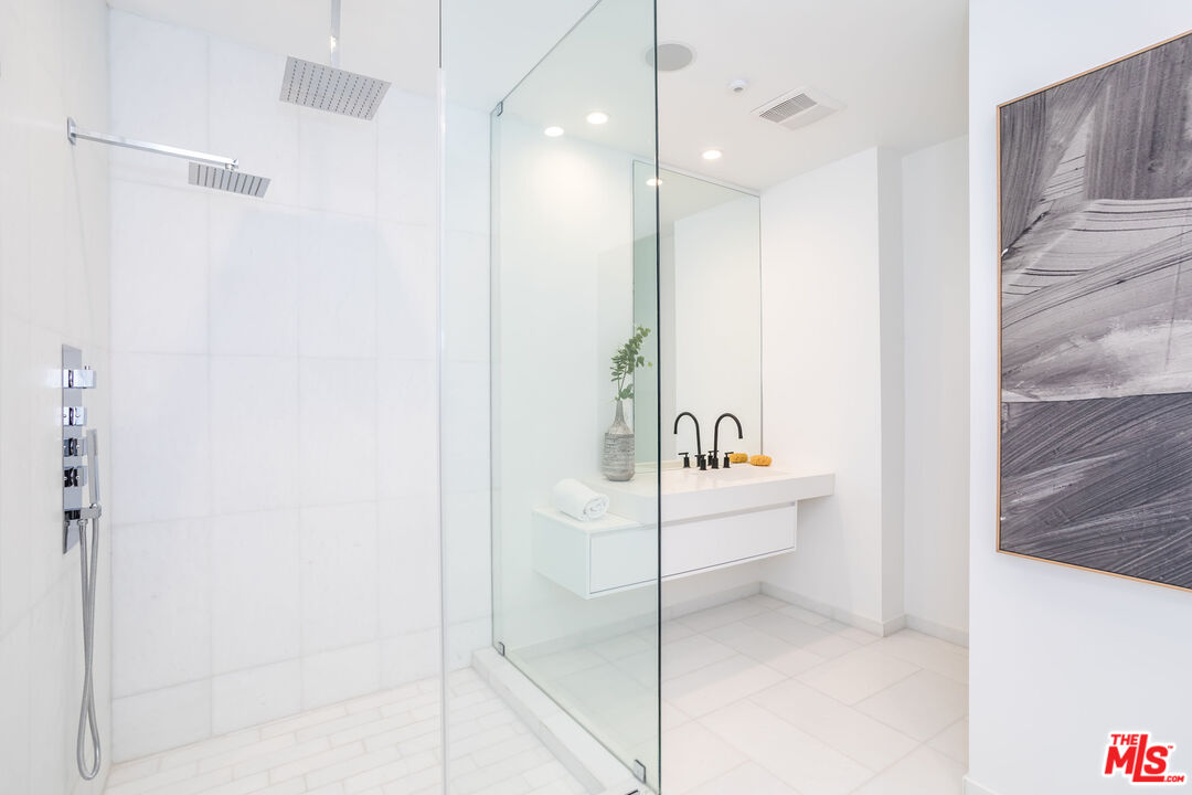 9406 Lloydcrest Drive Beverly Hills, CA 90210 - Photo 44 of 52 a bathroom with a bathtub and a shower