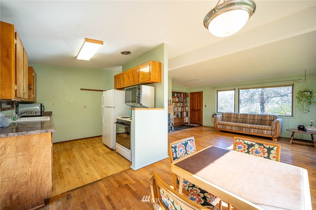 18101 Beall Road Southwest Vashon, WA 98070 - Photo 8 of 37 a kitchen with a sink appliances and a counter top space