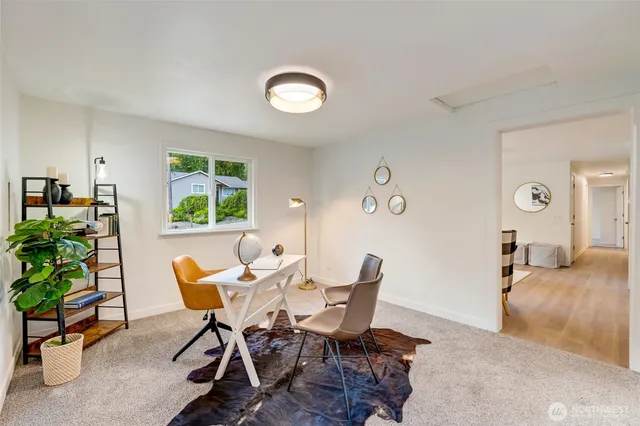 a workspace with furniture and a window