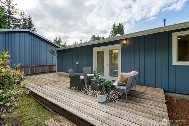 a view of backyard with sitting area