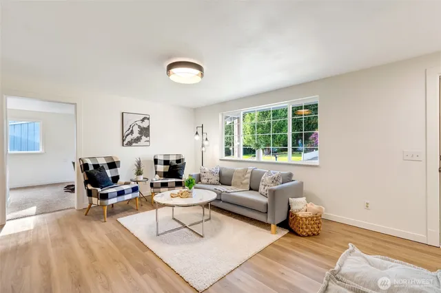 a living room with furniture and a window